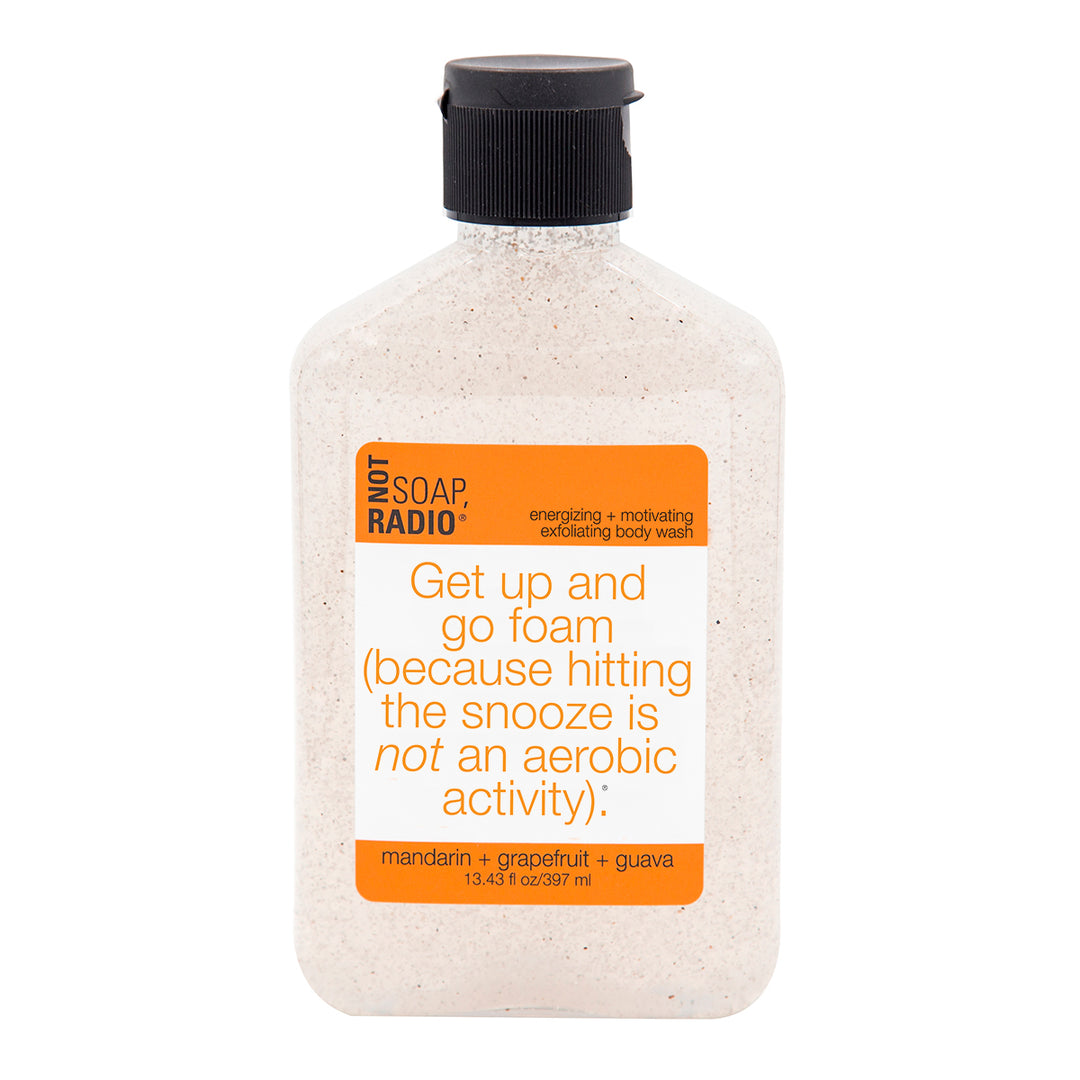 A mandarain, grapefruit, and guava scented exfoliating body wash on a white background.