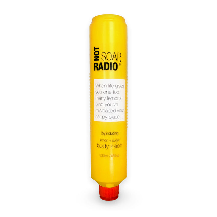 A lemon and sugar scented body lotion in a large bottle on a white background.