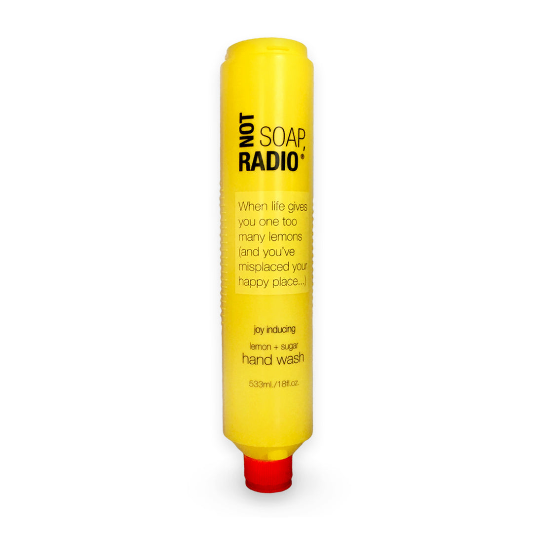 A lemon and sugar scented hand wash in a large bottle on a white background.