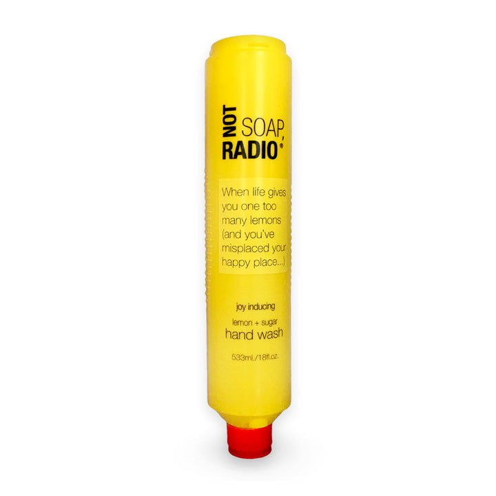 A lemon and sugar scented hand wash in a large bottle on a white background.
