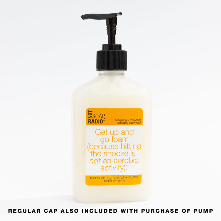 An orange colored body wash featuring the option to purchase a pump for the bottle.