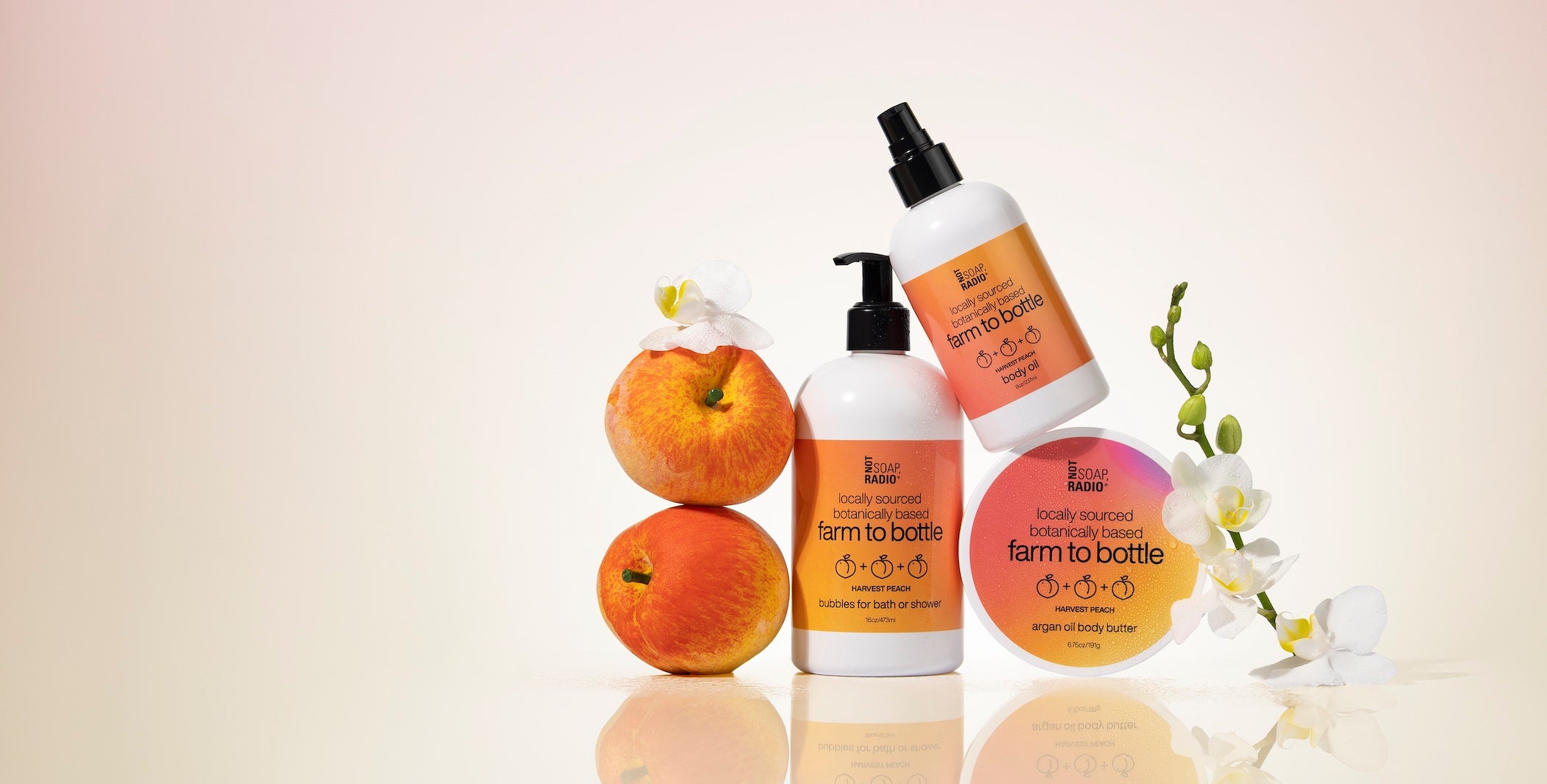 Harvest peach scented body wash, body oil and body butter with orchid flowers and fresh peaches