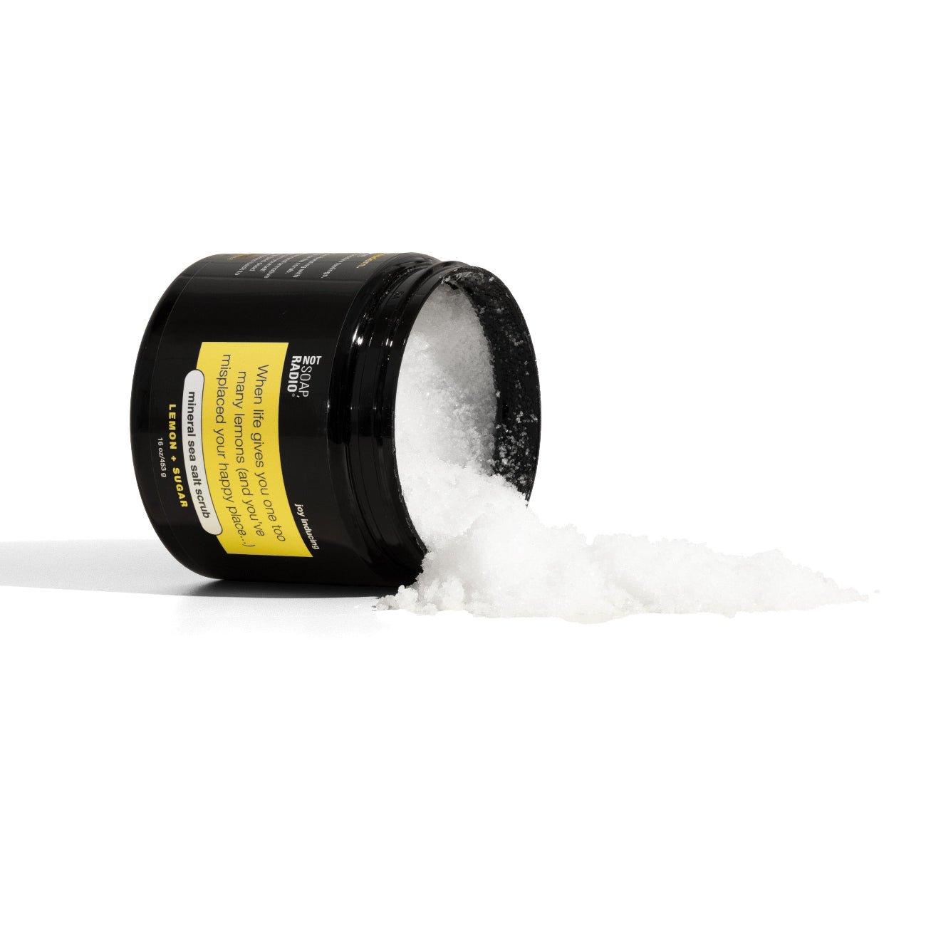 Lemon scented mineral sea salt scrub spilling out