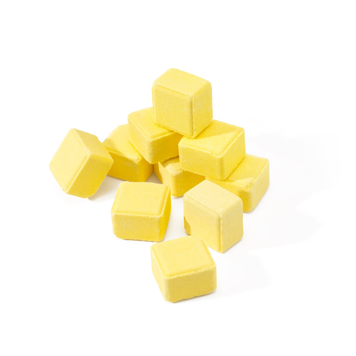 Ten lemon sugar scented shower steamers arranged in a pyramid, showing the full aromatherapy 10-pack shower steamer set