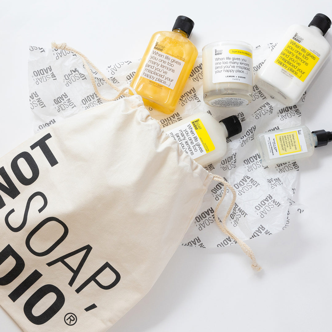 A large Not Soap Radio drawstring bag with the lemons and sugar bath and body collection coming out.