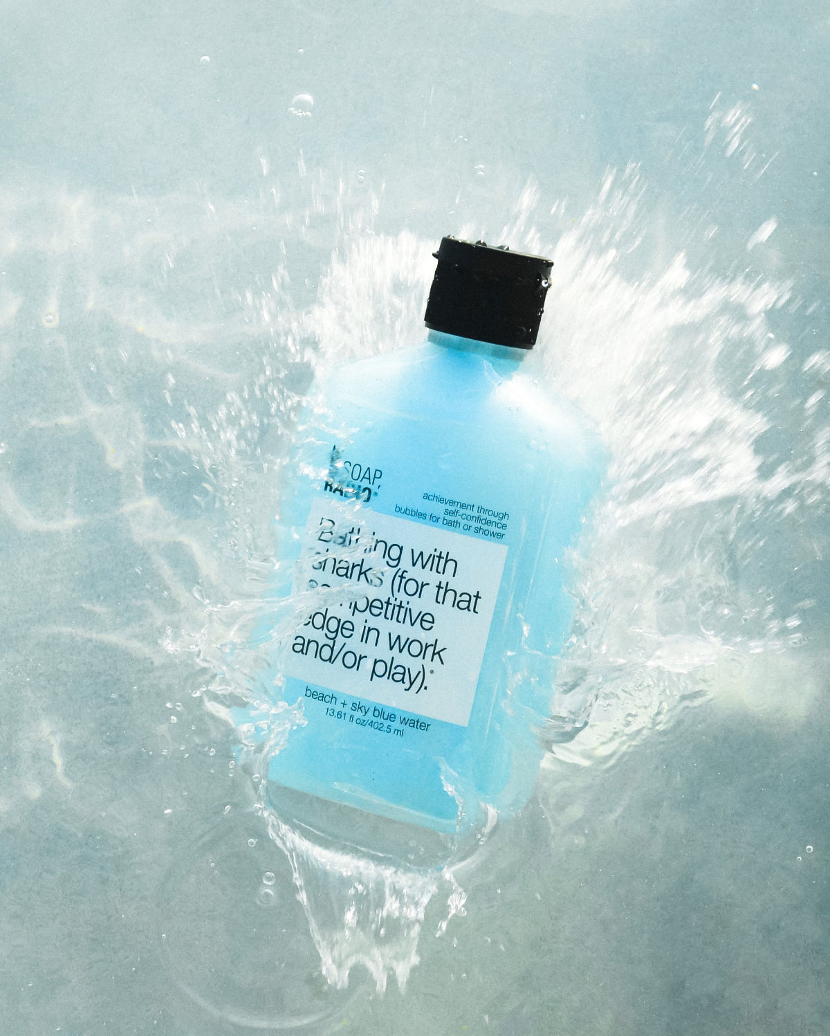 Bathing with sharks, beach scented body wash splashing into water