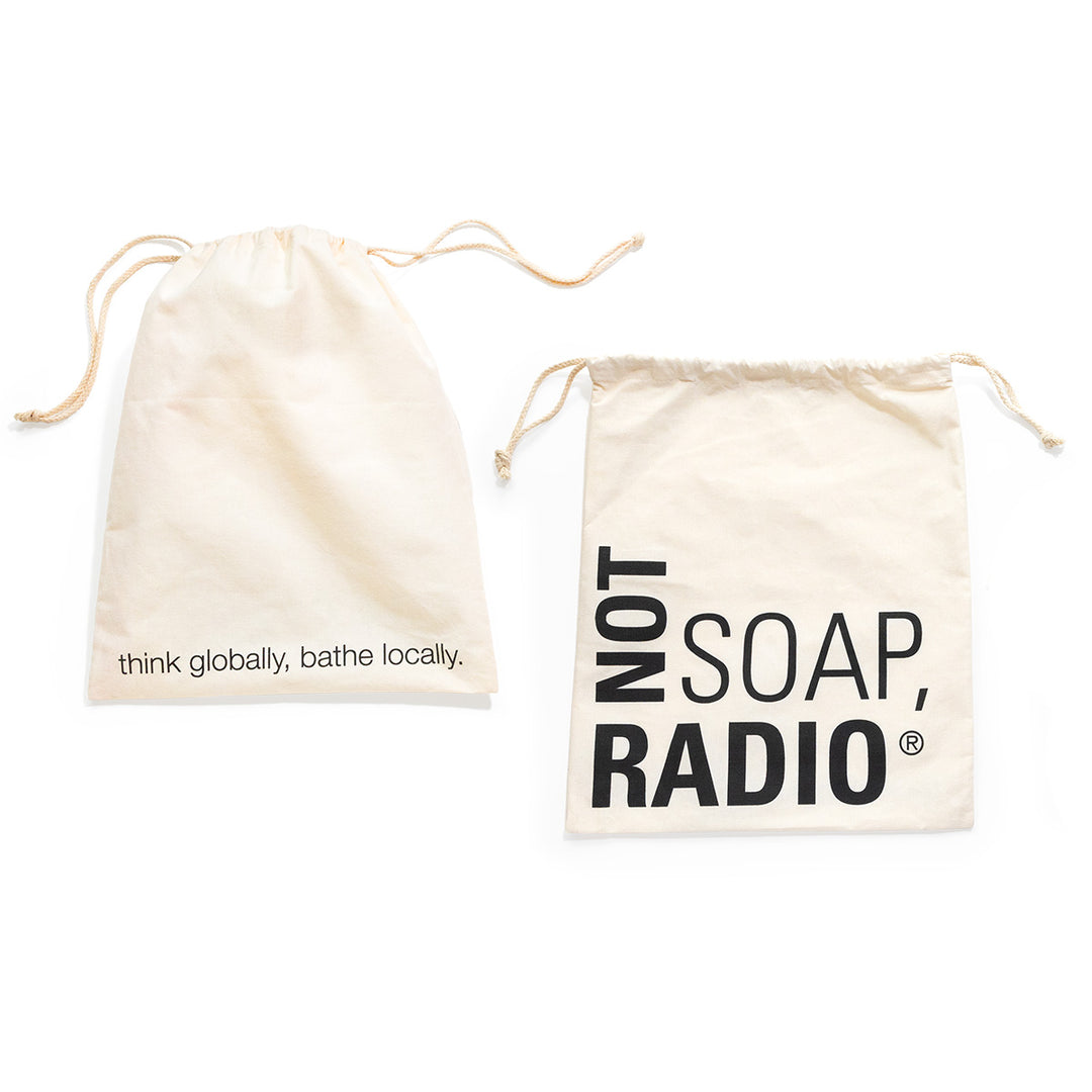 The front and back of a drawstring Not Soap Radio gift bag.