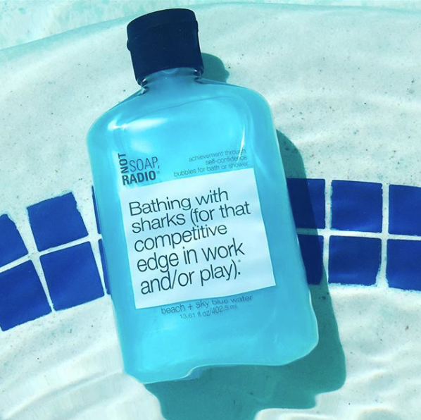 A sky blue water colored shower gel in the shallow end of a pool.