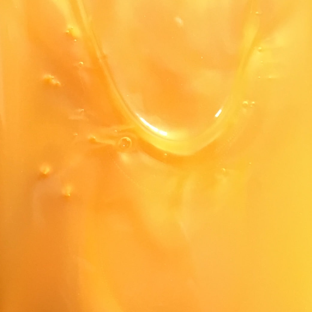 A close up of the orange color in a shower gel.