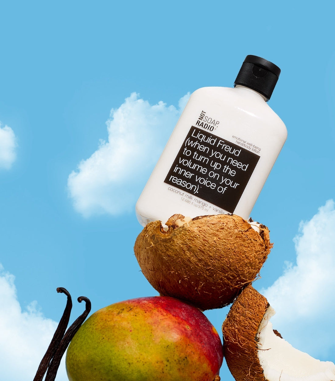 Not Soap Radio Liquid Freud lotion with coconuts, mango and vanilla ingredients on a sky background