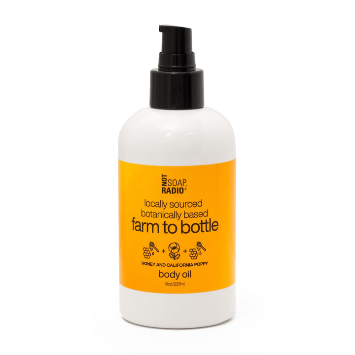 Front of Not Soap Radio Farm to Bottle Honey and California Poppy body oil with pump dispenser, photographed on a white background.