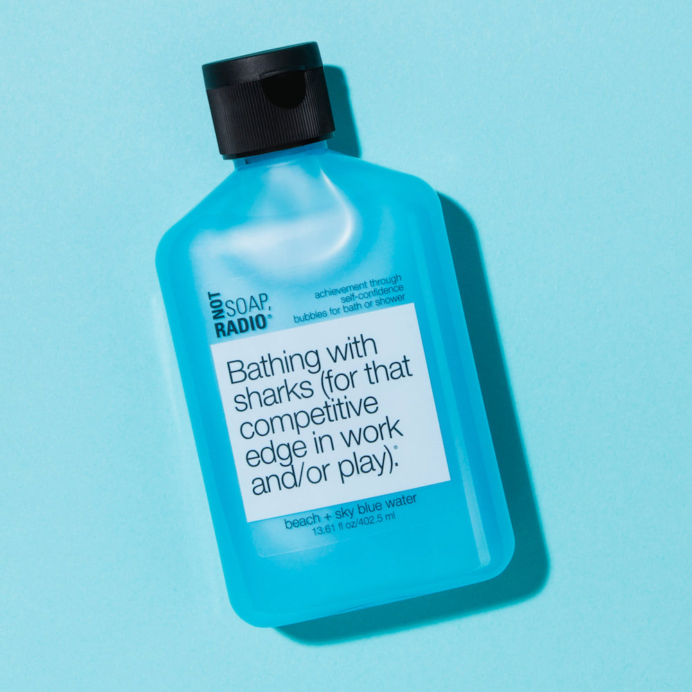 A blue bath or shower gel on top of a light blue background.