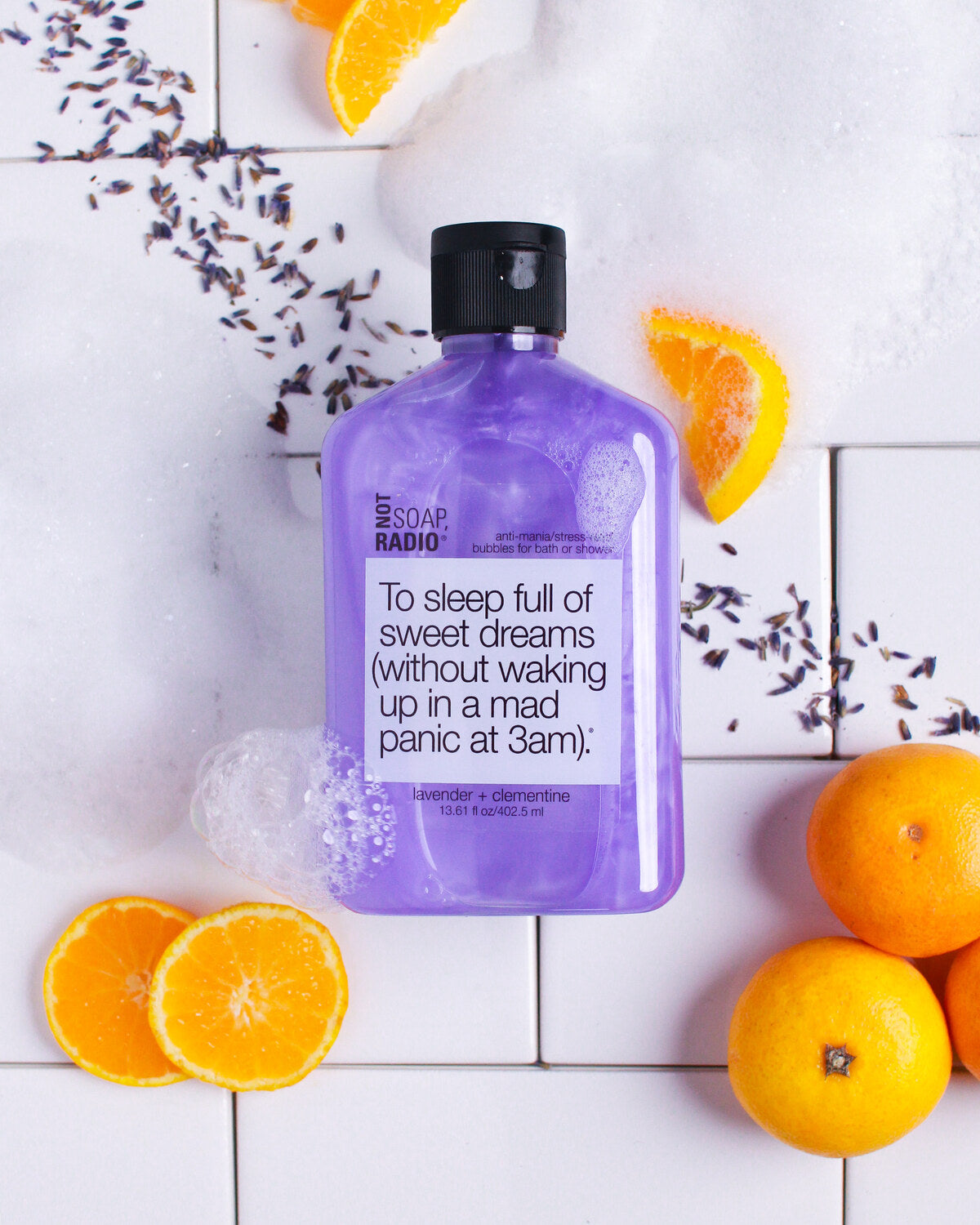 To sleep full of sweet dreams bubbles for bath/shower on a tile floor with lavender and clementines