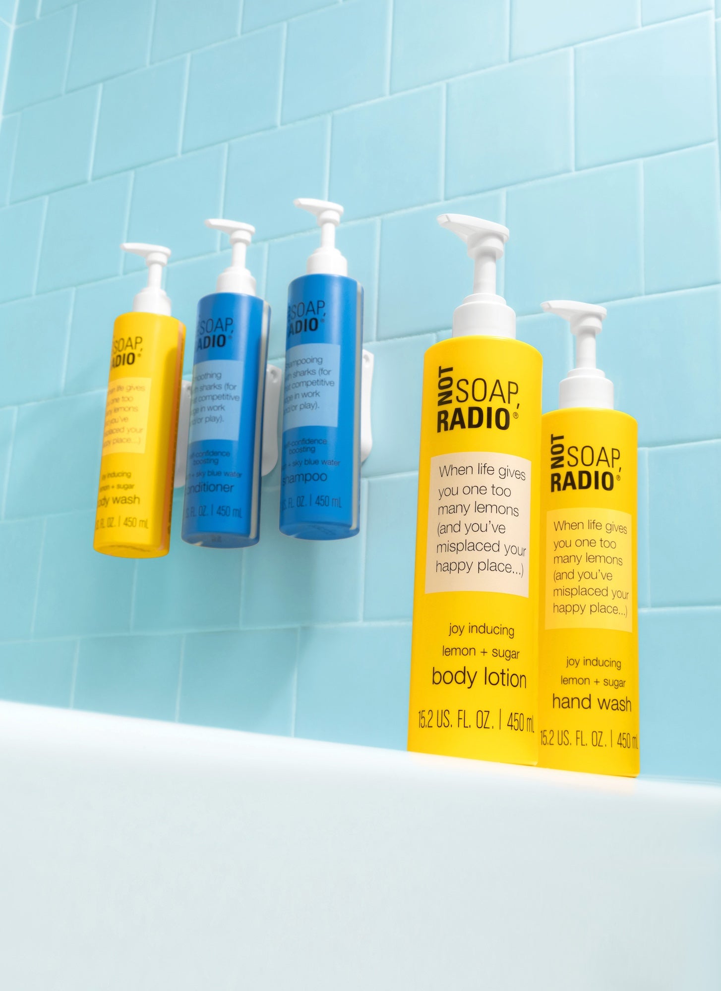 Wall mounted body wash, conditioner and shampoo pump bottles. When life gives you one too many lemons lotion and hand wash on the side of the tub.