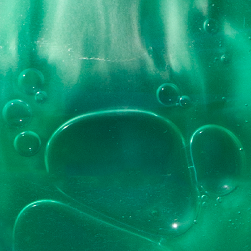 A close up of the green soap that comes with a four leaf clover bath and shower gel by Not Soap Radio.